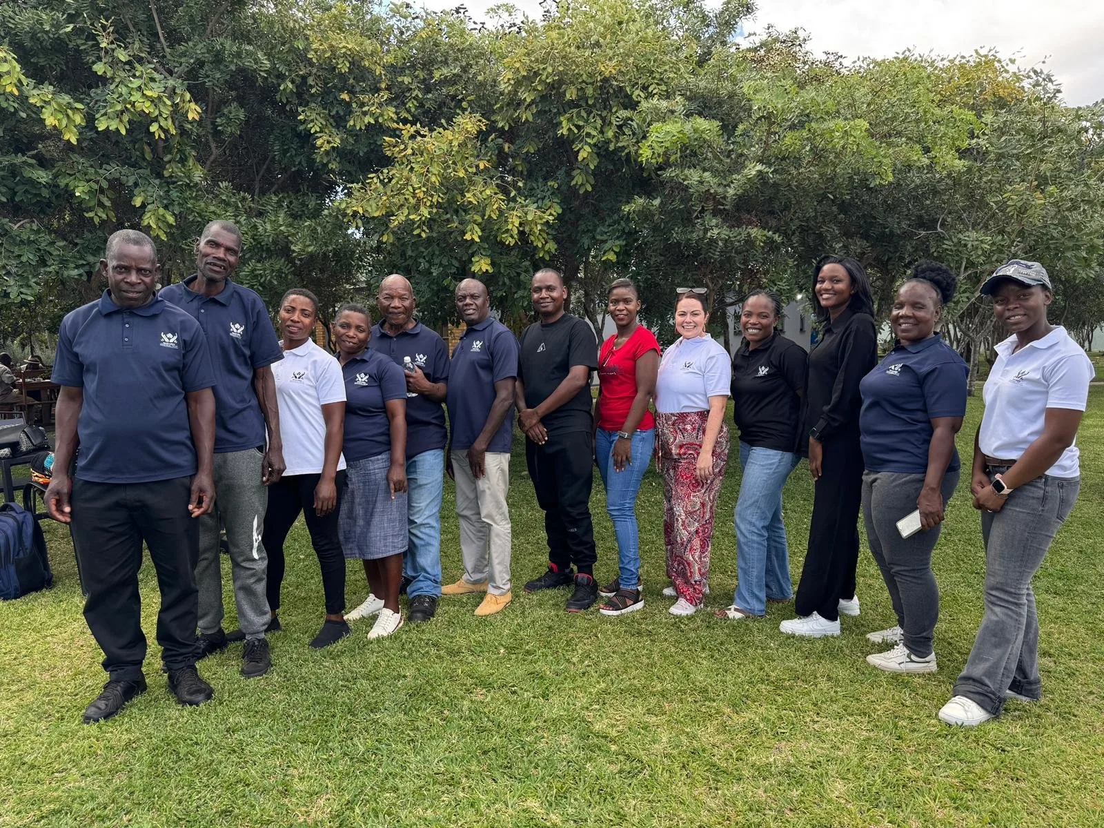 Rozaria Memorial Trust team members gathered outdoors